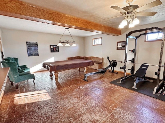 recreation room featuring billiards, baseboards, ceiling fan, beamed ceiling, and a textured ceiling