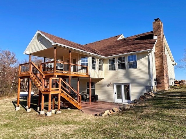 back of house with a patio, stairs, a yard, a wooden deck, and a chimney