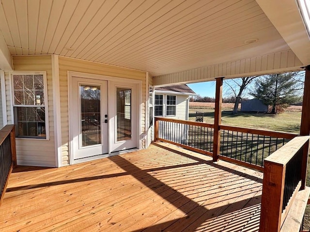 wooden deck featuring french doors