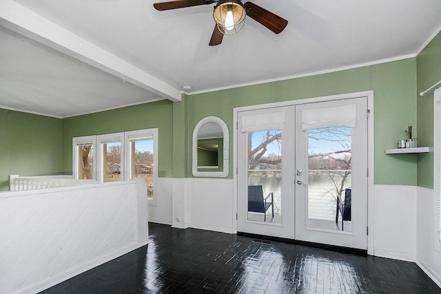 entryway with wainscoting, crown molding, dark wood-type flooring, and french doors