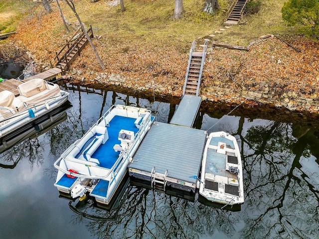 view of dock featuring a water view and stairway