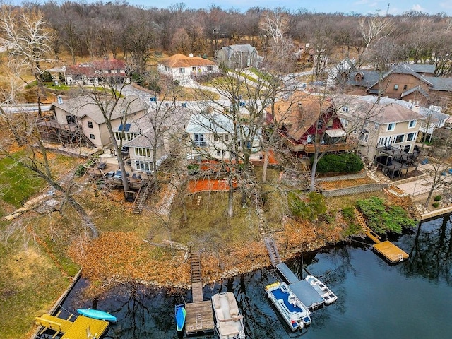 aerial view featuring a residential view and a water view