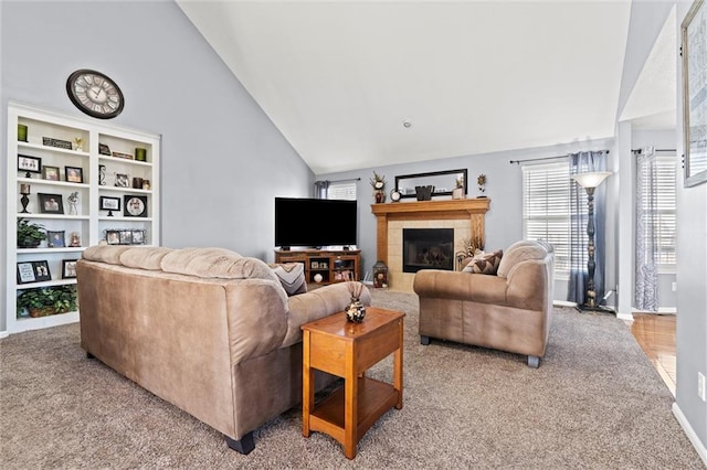 living room with a tile fireplace, high vaulted ceiling, baseboards, and carpet floors