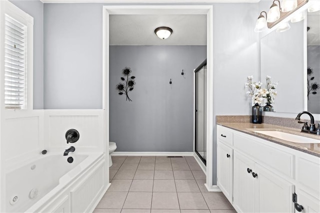 bathroom with toilet, a stall shower, a whirlpool tub, tile patterned flooring, and vanity