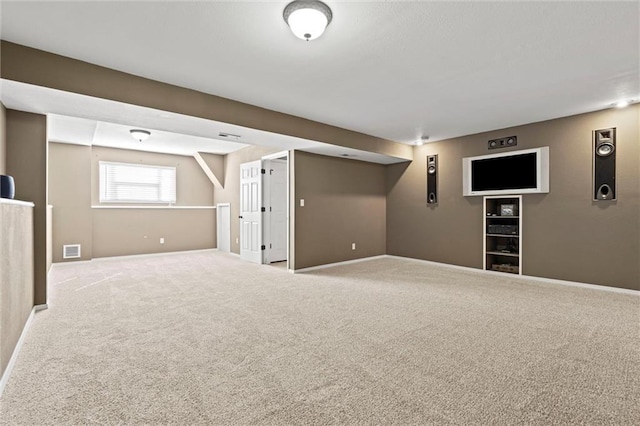 below grade area with visible vents, baseboards, and carpet flooring