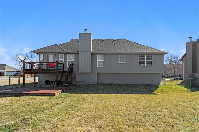 rear view of property featuring stairway, fence, a chimney, a deck, and a lawn