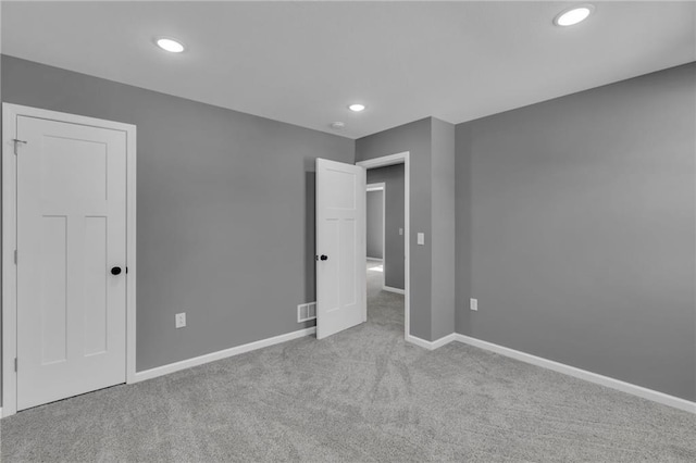 unfurnished bedroom with recessed lighting, baseboards, and carpet floors