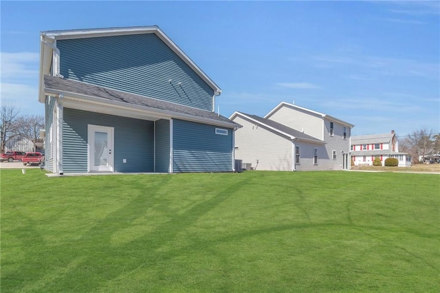 rear view of house with a lawn