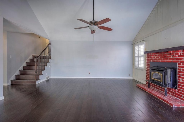 unfurnished living room with baseboards, hardwood / wood-style floors, and stairs