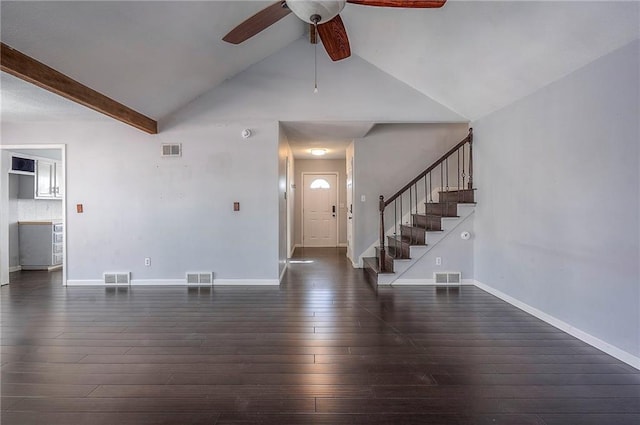 foyer entrance with stairway, visible vents, and hardwood / wood-style flooring