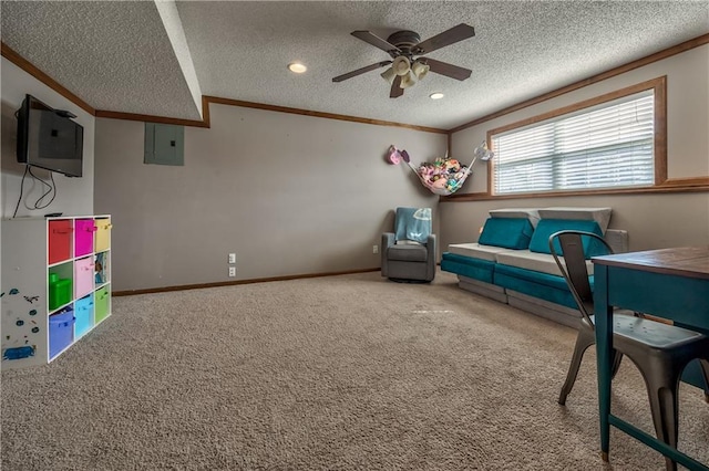 sitting room with baseboards, carpet, ornamental molding, and a textured ceiling