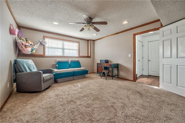 living area featuring carpet, a textured ceiling, ornamental molding, and baseboards