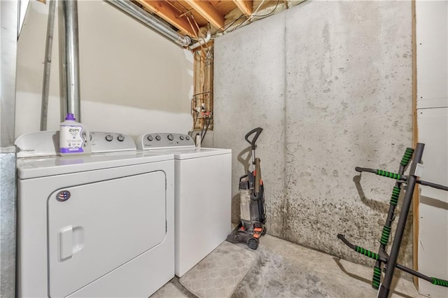 laundry room with laundry area and washing machine and clothes dryer