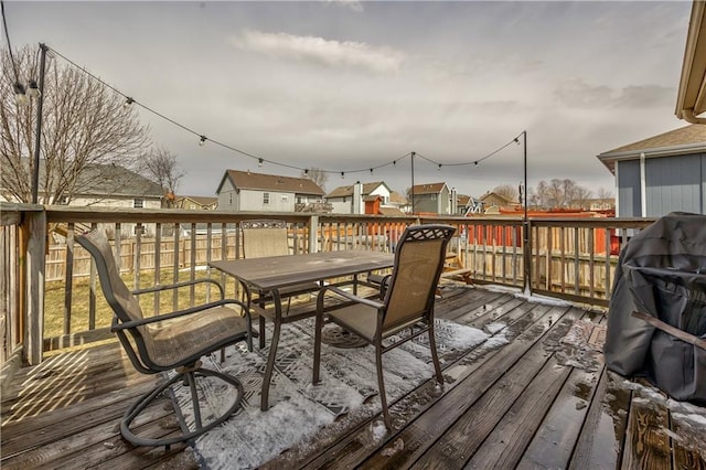 wooden deck with outdoor dining area