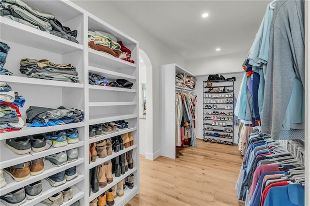 spacious closet featuring light wood-style flooring