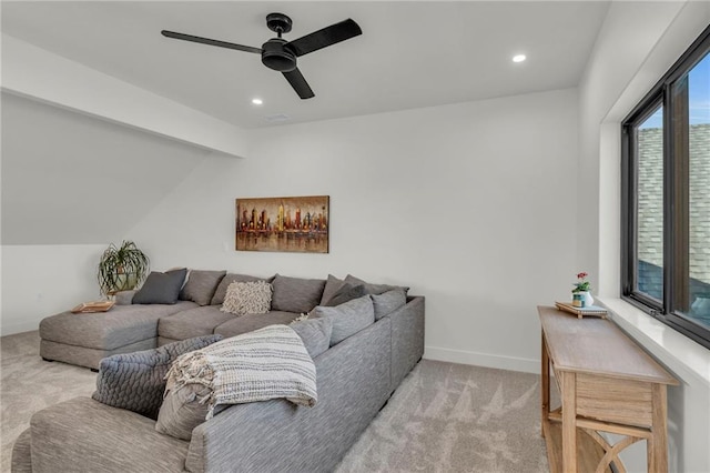 carpeted living area with recessed lighting, vaulted ceiling with beams, a ceiling fan, and baseboards