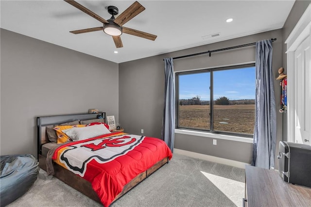 carpeted bedroom featuring recessed lighting, baseboards, visible vents, and ceiling fan