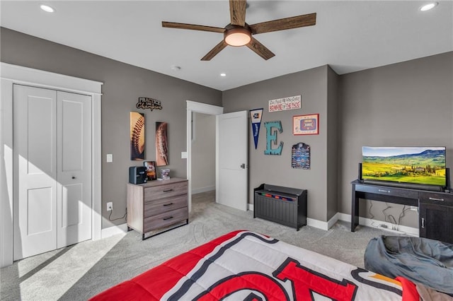 bedroom featuring light carpet, recessed lighting, and baseboards