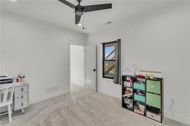 interior space with visible vents, baseboards, and ceiling fan