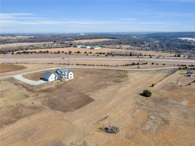 birds eye view of property featuring a rural view