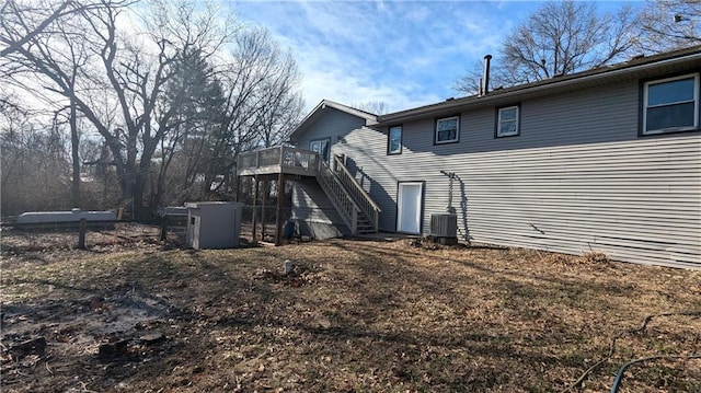 back of property with stairs, central AC unit, and a wooden deck