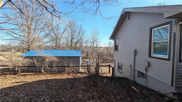 view of home's exterior with fence