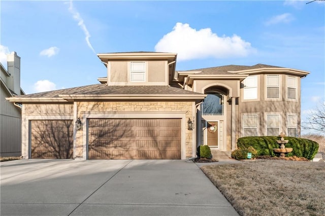 view of front of home with stone siding, stucco siding, an attached garage, and concrete driveway