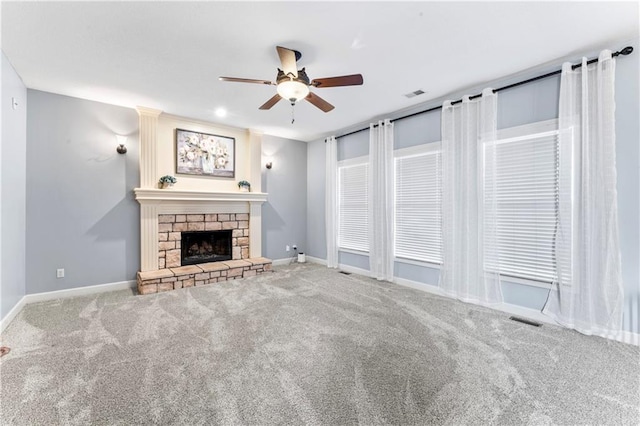 unfurnished living room with visible vents, carpet floors, and ceiling fan