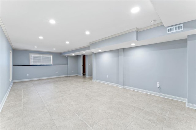 finished below grade area featuring visible vents, recessed lighting, and ornamental molding