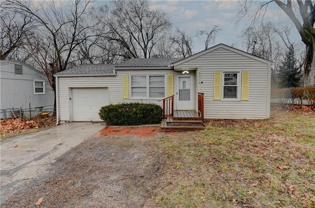 view of front of property with a garage and driveway