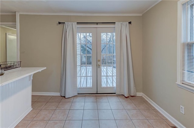 entryway featuring light tile patterned floors, french doors, and a healthy amount of sunlight