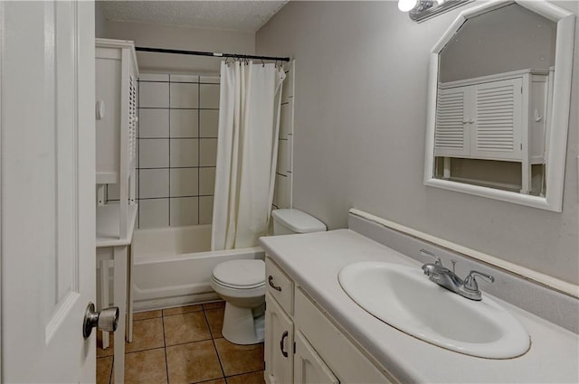 bathroom featuring shower / tub combo with curtain, toilet, vanity, a textured ceiling, and tile patterned floors