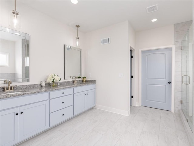 full bathroom with a shower stall, visible vents, and a sink