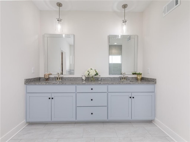 full bathroom featuring a sink, visible vents, and double vanity