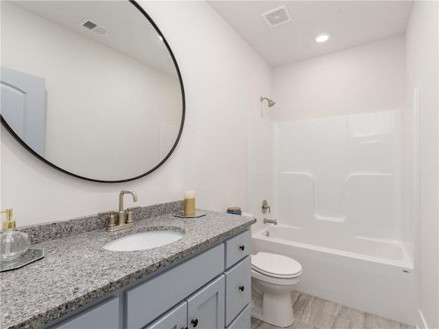 full bathroom with vanity, bathing tub / shower combination, toilet, and visible vents