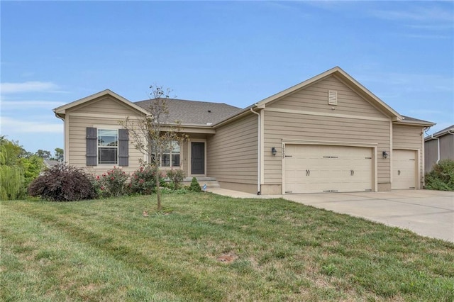 ranch-style house featuring concrete driveway, an attached garage, and a front yard