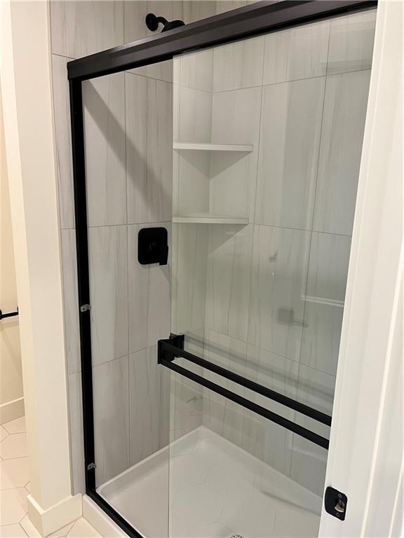 bathroom featuring a stall shower