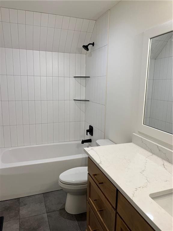 bathroom with washtub / shower combination, toilet, vanity, and tile patterned flooring