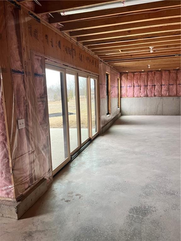 misc room featuring unfinished concrete flooring