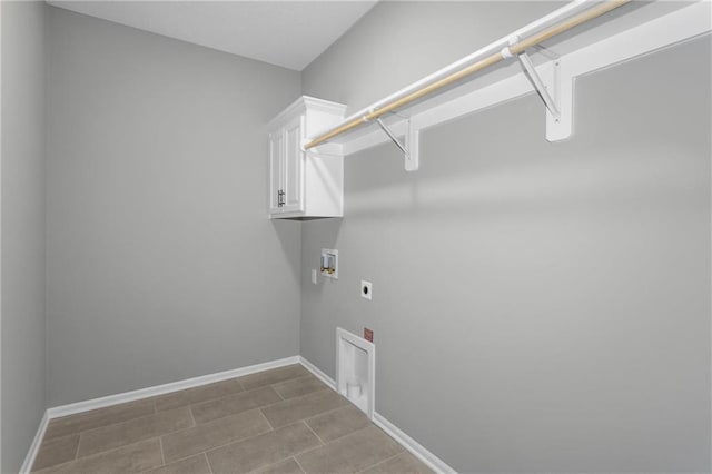 laundry area with cabinet space, hookup for a washing machine, electric dryer hookup, and baseboards