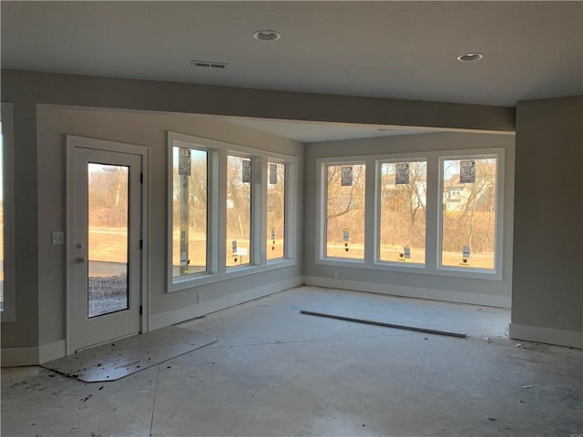 unfurnished sunroom with visible vents