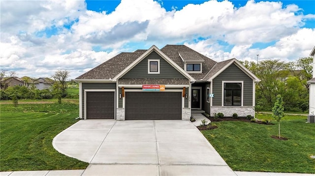 1510 NW 106th Ter, Kansas City, MO 64155 - craftsman-style house featuring a garage, stone siding, driveway, and a front yard