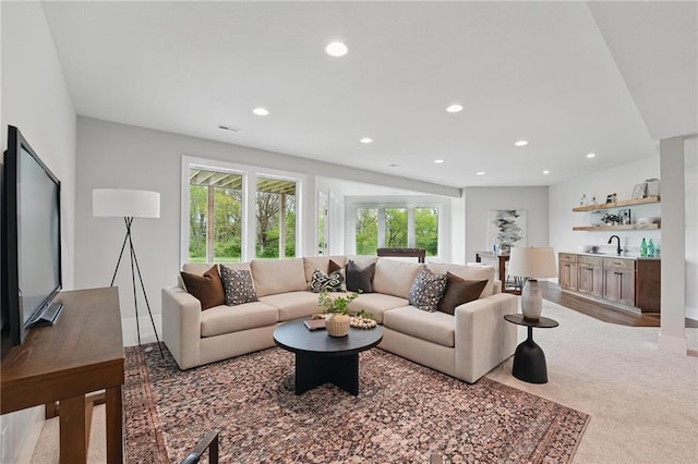 1510 NW 106th Ter, Kansas City, MO 64155 - living area featuring indoor wet bar, recessed lighting, visible vents, and light colored carpet