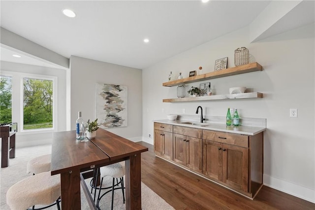 1510 NW 106th Ter, Kansas City, MO 64155 - bar with recessed lighting, baseboards, dark wood-style floors, and a sink