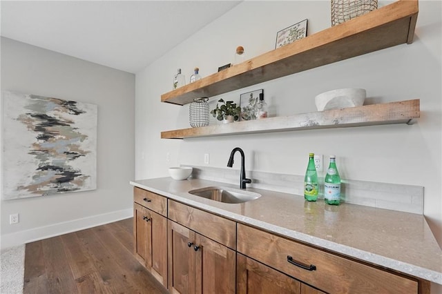 1510 NW 106th Ter, Kansas City, MO 64155 - bar featuring a sink, baseboards, and dark wood finished floors