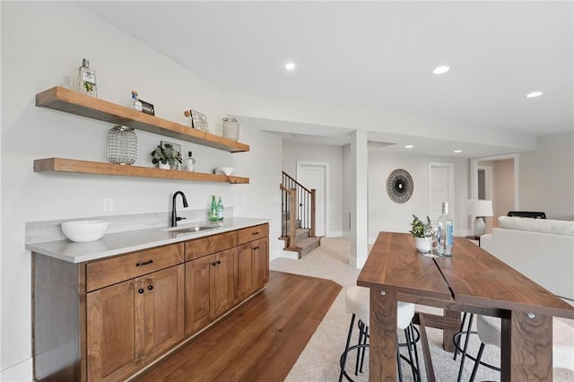 1510 NW 106th Ter, Kansas City, MO 64155 - interior space featuring stairs, recessed lighting, dark wood finished floors, and a sink