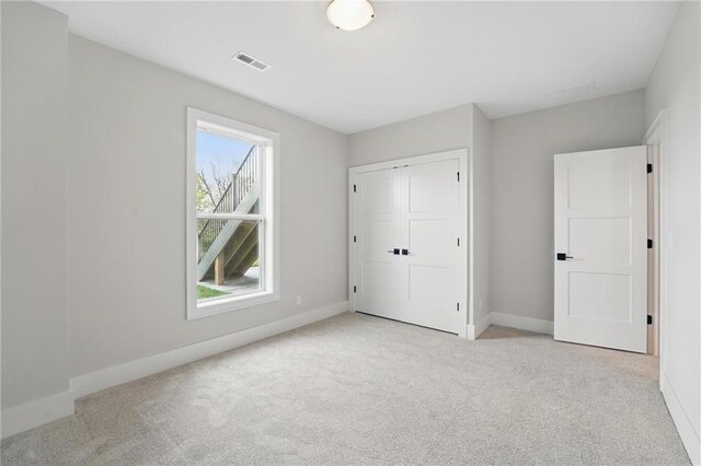 1510 NW 106th Ter, Kansas City, MO 64155 - unfurnished bedroom with carpet floors, baseboards, visible vents, and a closet