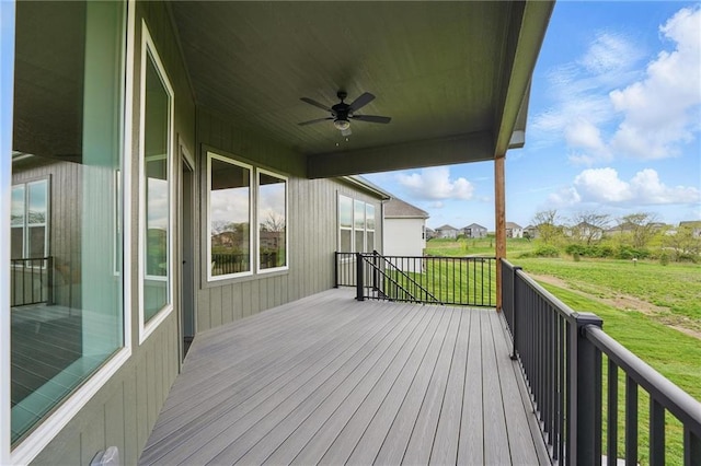 1510 NW 106th Ter, Kansas City, MO 64155 - wooden deck featuring a lawn and a ceiling fan