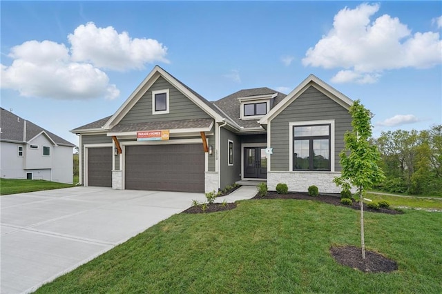 1510 NW 106th Ter, Kansas City, MO 64155 - craftsman-style house with a shingled roof, a front lawn, stone siding, a garage, and driveway