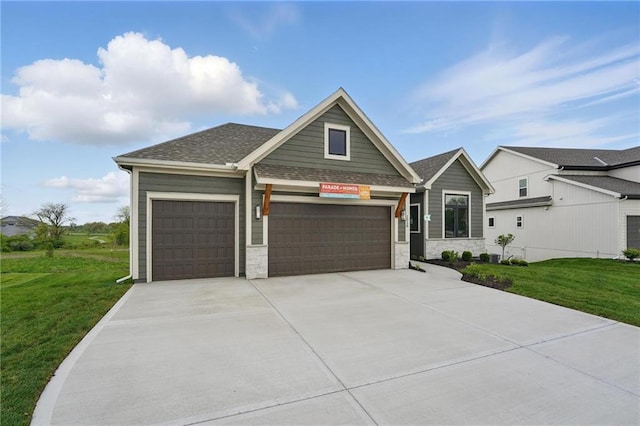 1510 NW 106th Ter, Kansas City, MO 64155 - craftsman-style house featuring a garage, a front lawn, stone siding, roof with shingles, and driveway